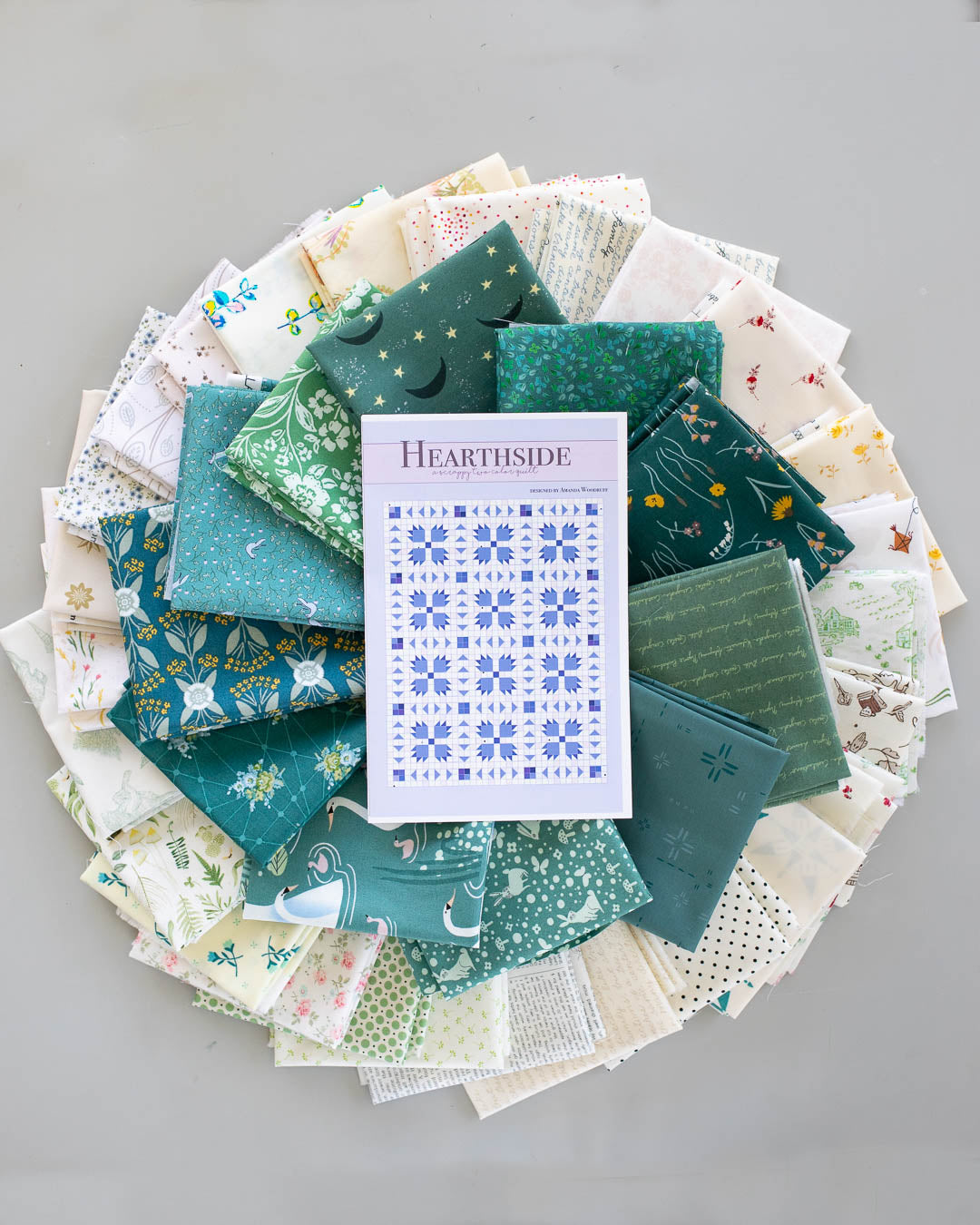 flat lay of teal hearthside fat quarter bundle with pattern in circle shape