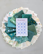 flat lay of teal hearthside fat quarter bundle with pattern in circle shape