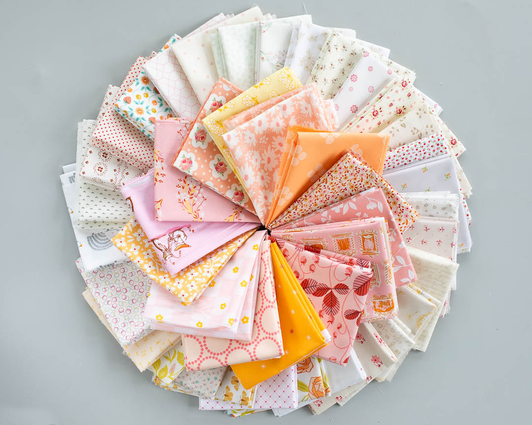 sherbet colored fat quarter bundle of 44 fabircs in a circle